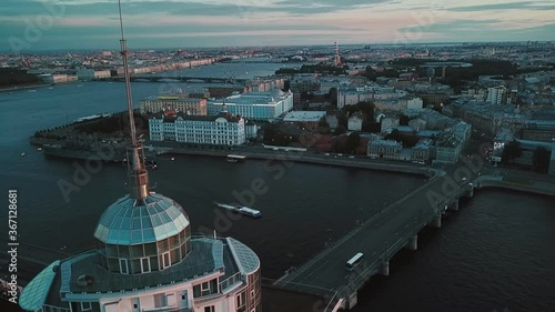 Panoramic view evening Petersburg cityscape with Neva river. Petrogradskaya embankment. Road traffic. People walk. Bridges photo