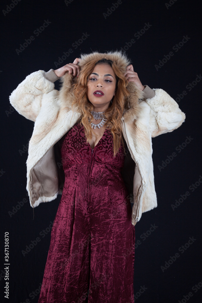 Lovely Hispanic woman in a hooded white fur coat Lovely Hispanic woman in a hooded white fur coat