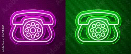 Glowing neon line Telephone icon isolated on purple and green background. Landline phone. Vector Illustration.