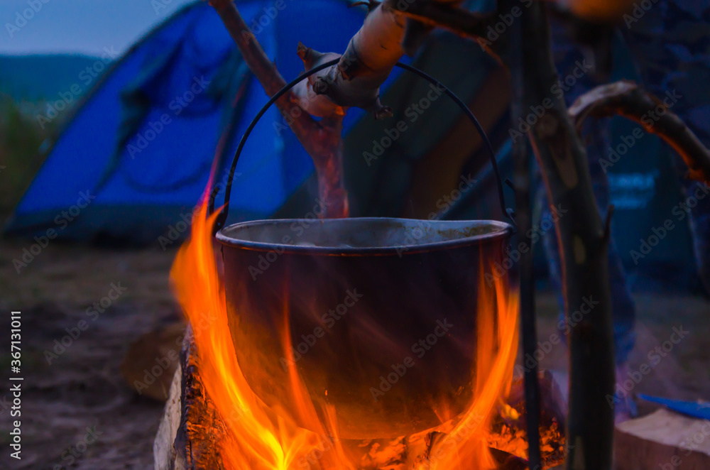  camping cauldron. cauldron at the stake. rest by the river