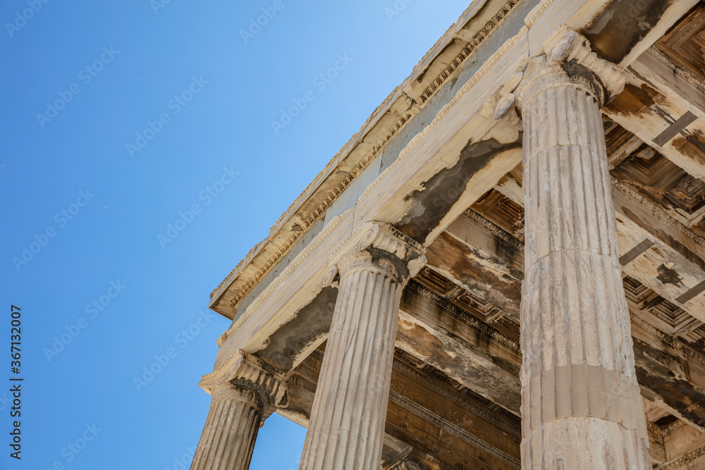 Naklejka premium Athens, Greece. Erechtheion Temple of Athena on Acropolis hill, blue sky background
