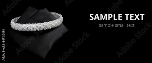 Jewellery white gemstone diamonds hair band tiara on black background. Wide mockup postcard for copy space