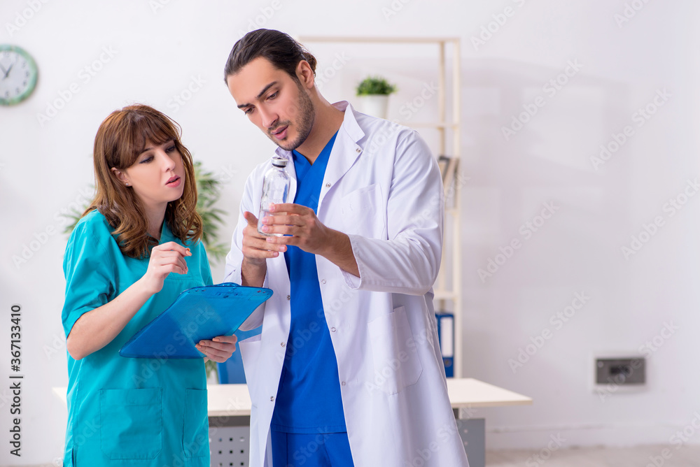Two doctors colleagues working in the hospital Two doctors colleagues working in the hospital