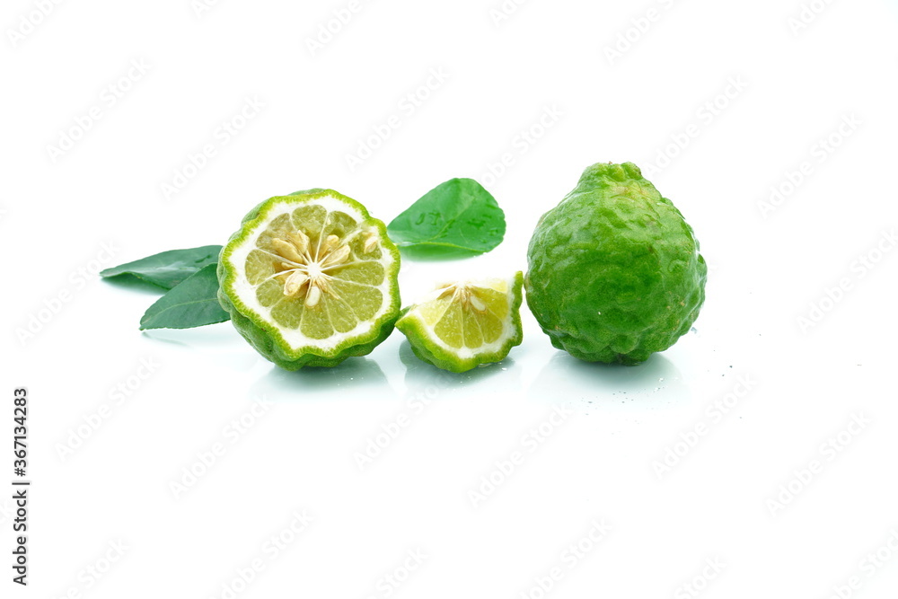 Fresh kaffir lime cut in half On a white background