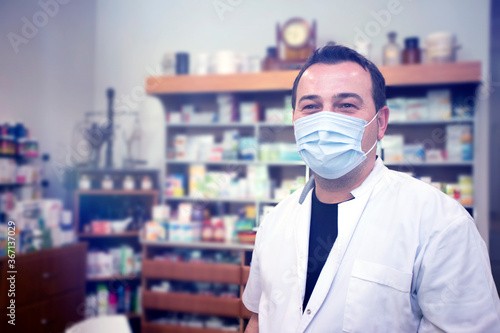 Pharmacist working. Protection in pharmacies. Working in an Alarm State. Protection against coronavirus.