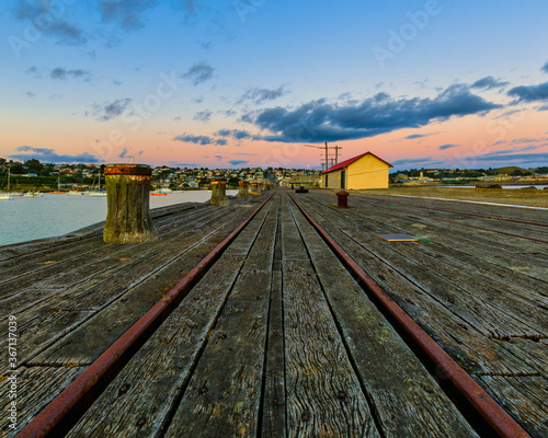 The quay in Oamaru harbour at dawn, just before sunrise. photo