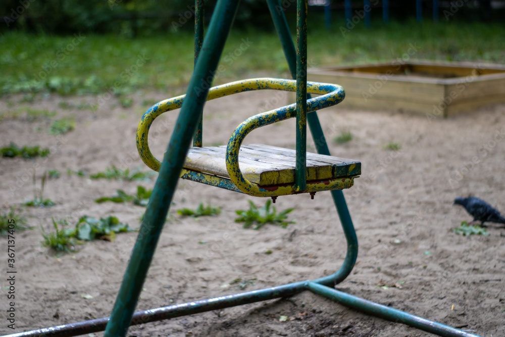 Very old swing for children. Old playground. Very old swing for children. Old playground.
