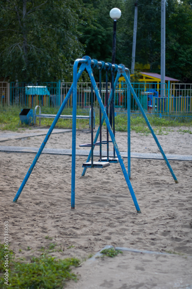 Very old swing for children. Old playground. Very old swing for children. Old playground.