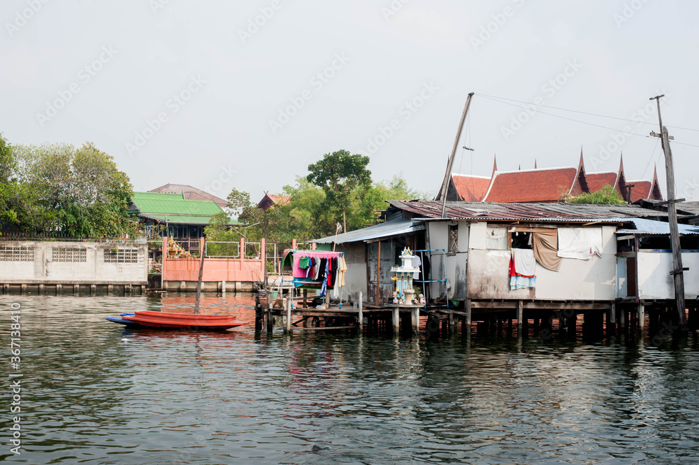 Old Canal house at Phra khanong canal in front of Wat Mahabut Temple, Bangkok Thailand
Old Canal house at Phra khanong canal in front of Wat Mahabut Temple, Bangkok Thailand