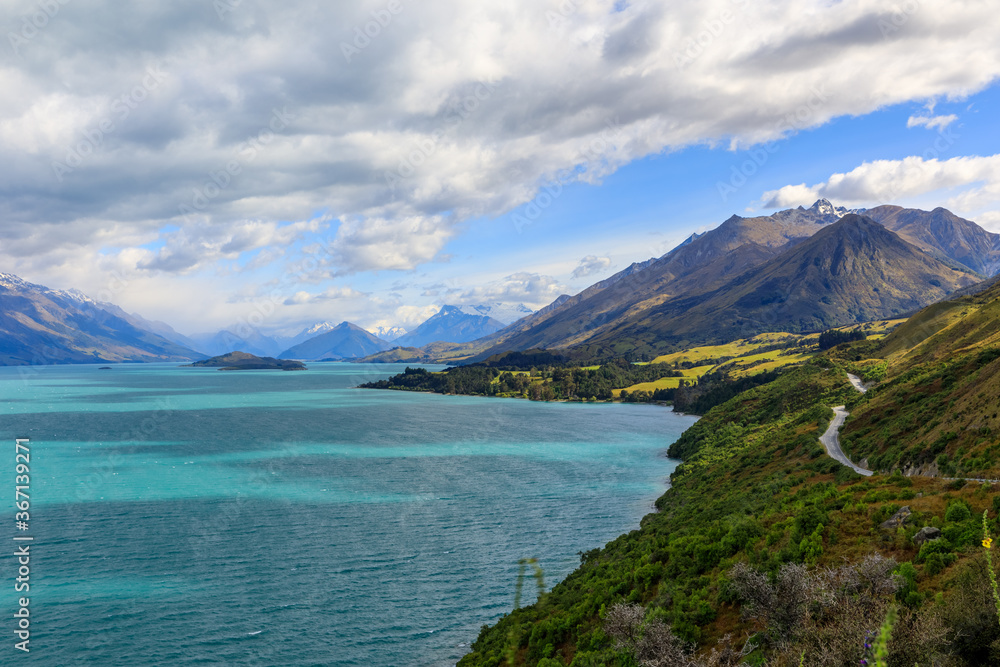 The road between Glenorchy and Queenstown next to Lake Wakatipu. From the view of Bennetts Bluff Lookout towards the mountains.