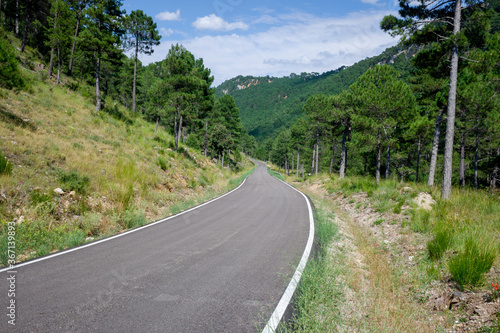 Detail of a steep mountain road, seen from the asphalt.