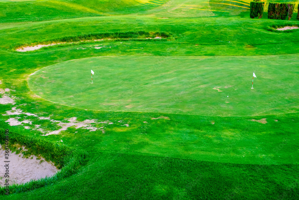 An empty golf course green a little run down. An empty golf course green a little run down.
