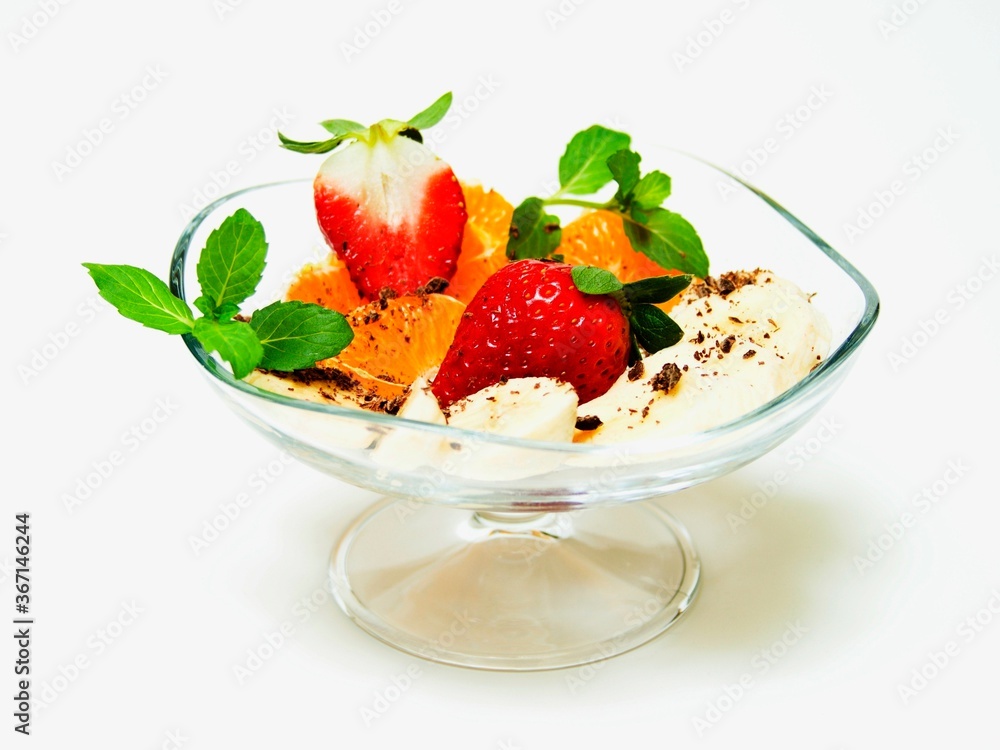 Fruit cup with strawberries and chocolate on a white background.
Fruit cup with strawberries and chocolate on a white background.