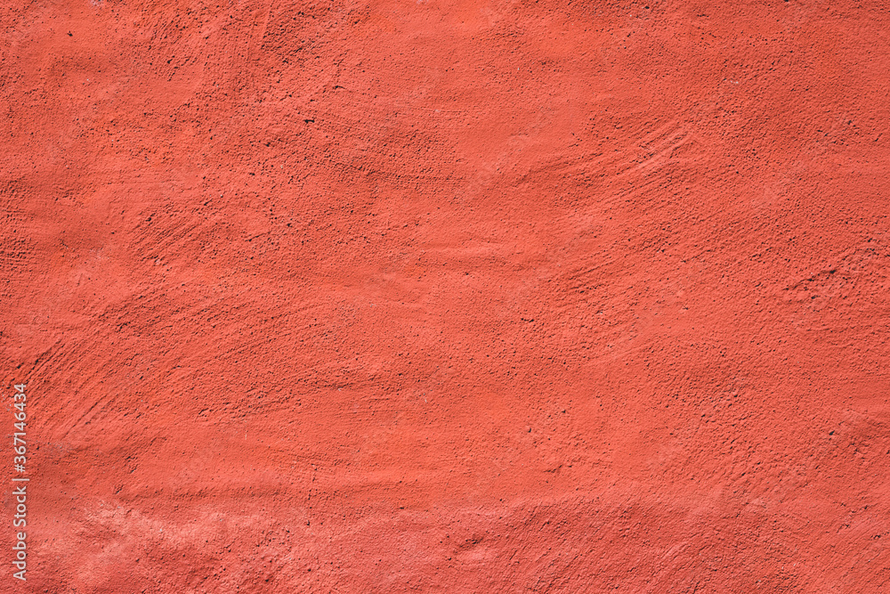Living coral color painted wall. Perfect for texture, background.