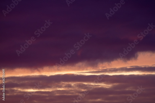 Fototapeta Naklejka Na Ścianę i Meble -  Dark purple and vanilla clouds. Sunset. Beautiful natural background.