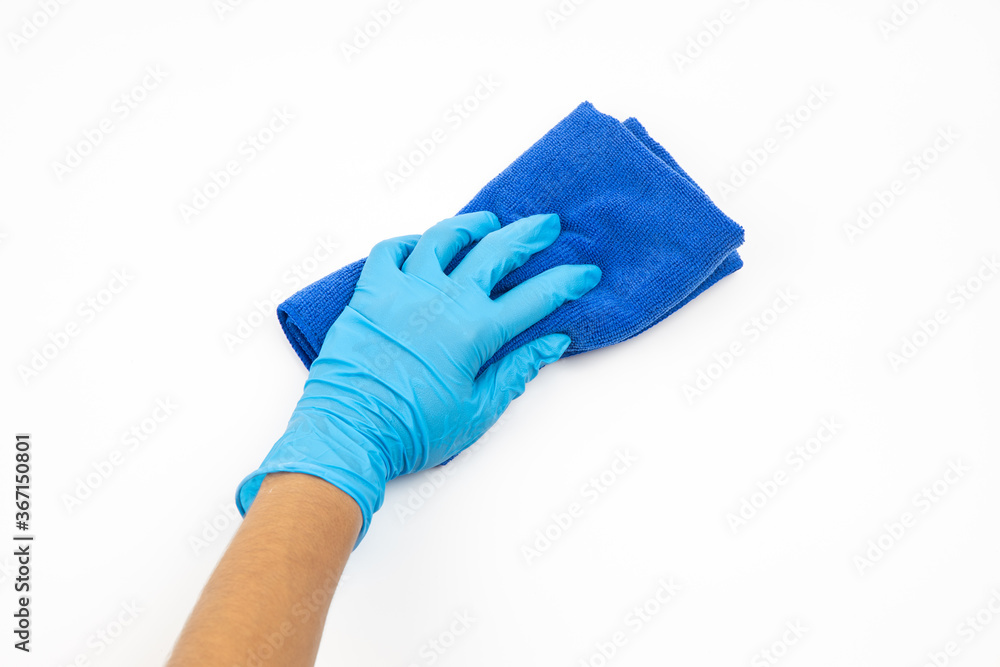 Close up of hands in rubber protective blue gloves cleaning the blue surface with a rag. Home, housekeeping concept Close up of hands in rubber protective blue gloves cleaning the blue surface with a rag. Home, housekeeping concept