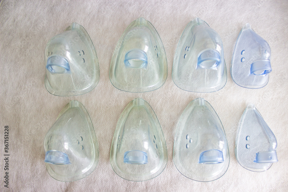 Eight blue medical masks top view on medical material. Eight blue medical masks top view on medical material.