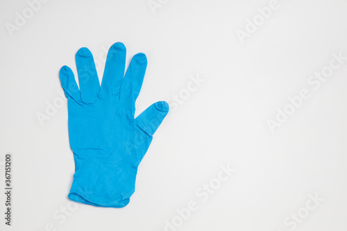 Wallpaper Mural blue rubber glove isolated on white background Torontodigital.ca