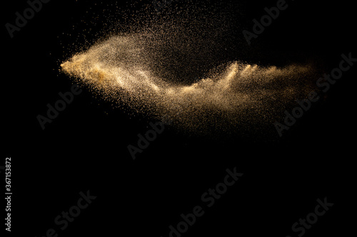 Abstract cloud motion blurred sand background.Sandy explosion isolated on over dark background.