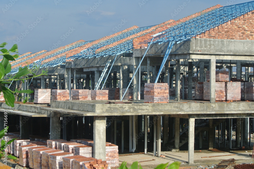 SEREMBAN, MALAYSIA -APRIL 07, 2020: New double story luxury terrace house under construction in Malaysia. Designed by an architect with a modern and contemporary style. SEREMBAN, MALAYSIA -APRIL 07, 2020: New double story luxury terrace house under construction in Malaysia. Designed by an architect with a modern and contemporary style.