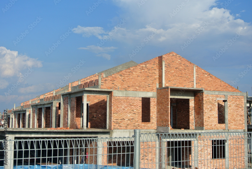 SEREMBAN, MALAYSIA -APRIL 07, 2020: New double story luxury terrace house under construction in Malaysia. Designed by an architect with a modern and contemporary style. SEREMBAN, MALAYSIA -APRIL 07, 2020: New double story luxury terrace house under construction in Malaysia. Designed by an architect with a modern and contemporary style.