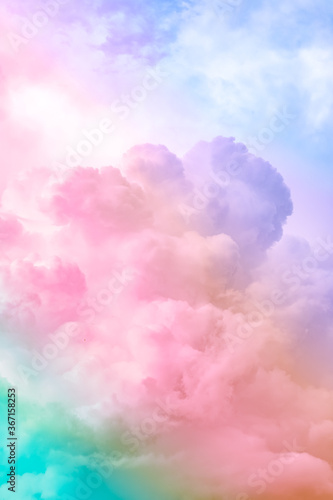 Fluffy white clouds in a bright blue sky.  Dramatic and colorful cloud background with mixed pastels.