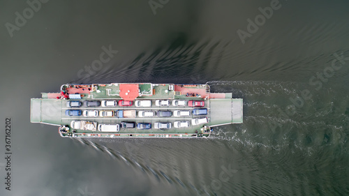 top down view of ferryboat sailing. Ferryboat transferring cars. Ferry transfers cars and passengers to the other side