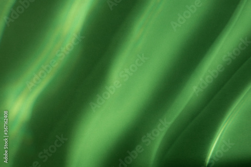 Abstract background, interference patterns formed by light. Green background. Green friday