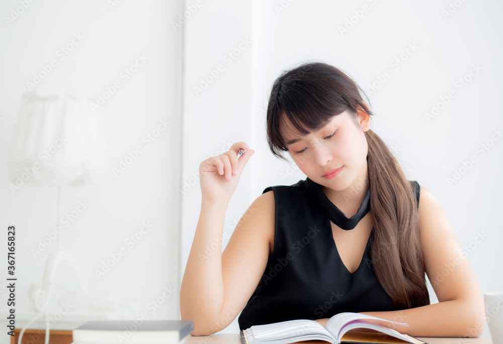 Beautiful asian woman writer smiling thinking idea and writing on notebook or diary on desk office, lifestyle of asia girl is success, female planning working, education and business concept. Beautiful asian woman writer smiling thinking idea and writing on notebook or diary on desk office, lifestyle of asia girl is success, female planning working, education and business concept.