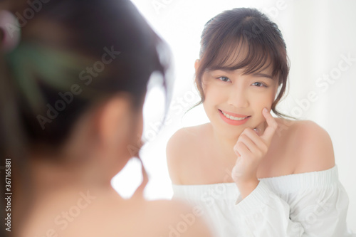 Beautiful face young asian woman with happy smiling and looking mirror, makeup of beauty facial girl with skincare and cosmetic treatment, refresh of female and clean for charming, healthy concept. Free Download Beautiful face young asian woman with happy smiling and looking mirror, makeup of beauty facial girl with skincare and cosmetic treatment, refresh of female and clean for charming, healthy concept. - GFXLoad