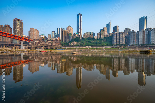 Chongqing, China cityscape at the Jialing River and Qianximen Bridge