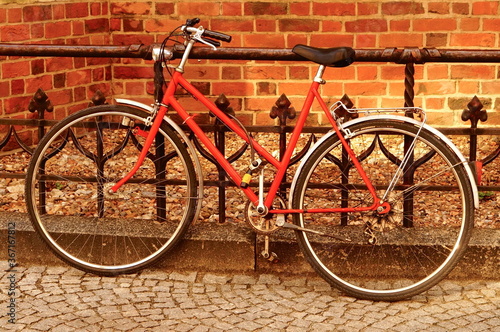 red bike on brick wall background