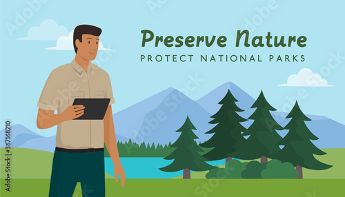 Ranger walking in a national park and holding a tablet