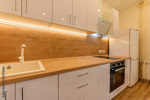 Russia, Moscow- February 10, 2020: interior room apartment modern bright cozy atmosphere. general cleaning, home decoration, modern kitchen, dining area