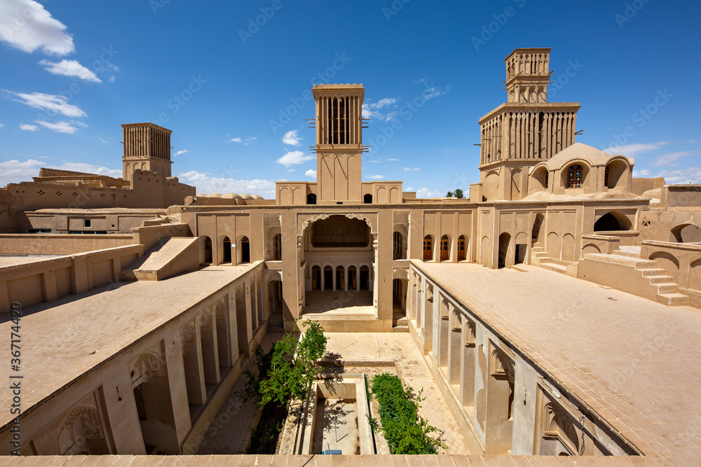 Historical house with wind towers known also as wind catchers, in Abarkuh, Iran