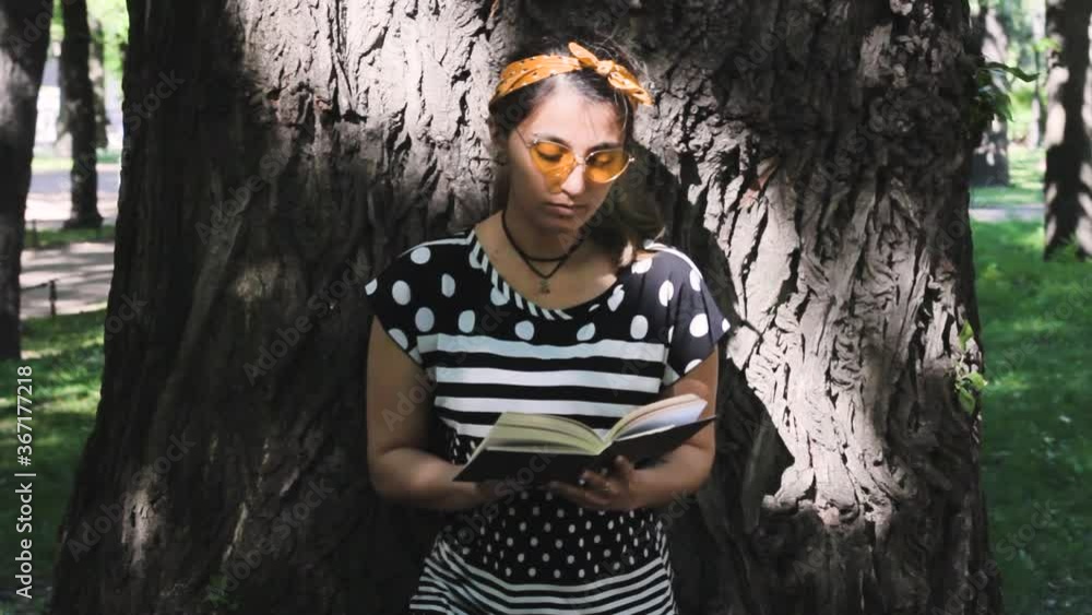 fashion hipster girl reading a book near the tree harmony fashion hipster girl reading a book near the tree harmony