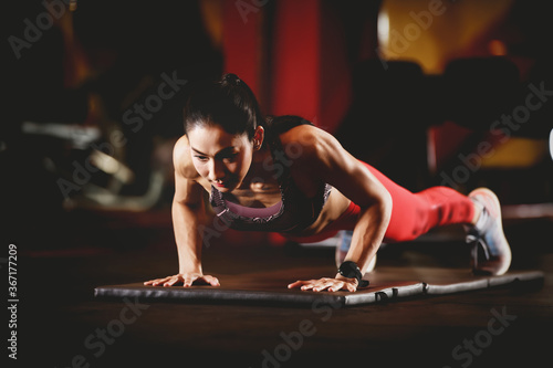 asian woman doing plank exercise