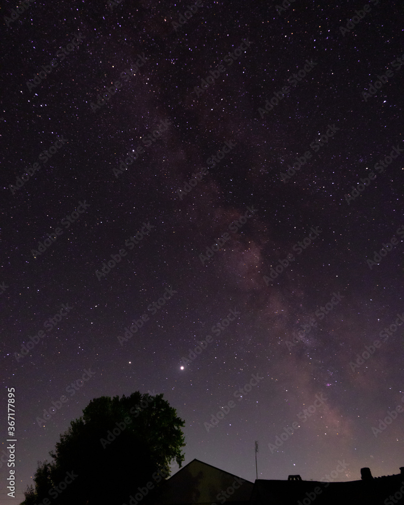 Fototapeta premium View of the milky way from the Northern hemisphere of the planet Earth. Beautiful bright night starry sky. Many different constellations in the black night sky. Galaxy with cosmic bodies.