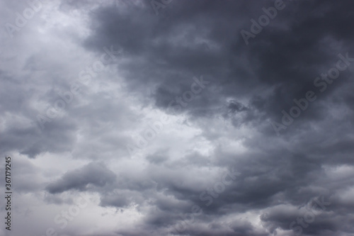 Dark and light grey clouds on sky. Gloomy day concept. Sky before rain. Clouds texture for backgrounds.