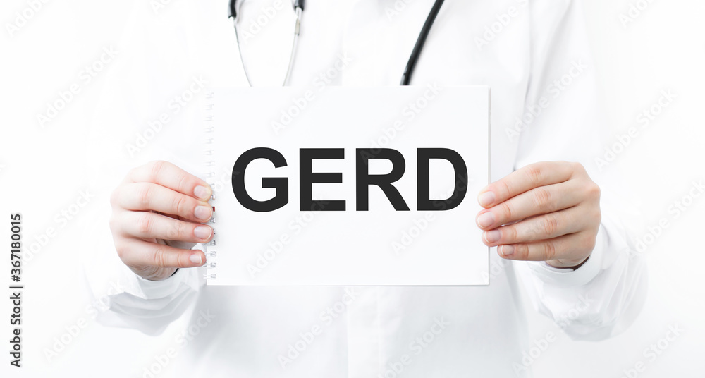 Doctor holding a card with text GERD, medical concept Doctor holding a card with text GERD, medical concept