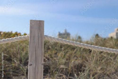 Wooden fence post with rope