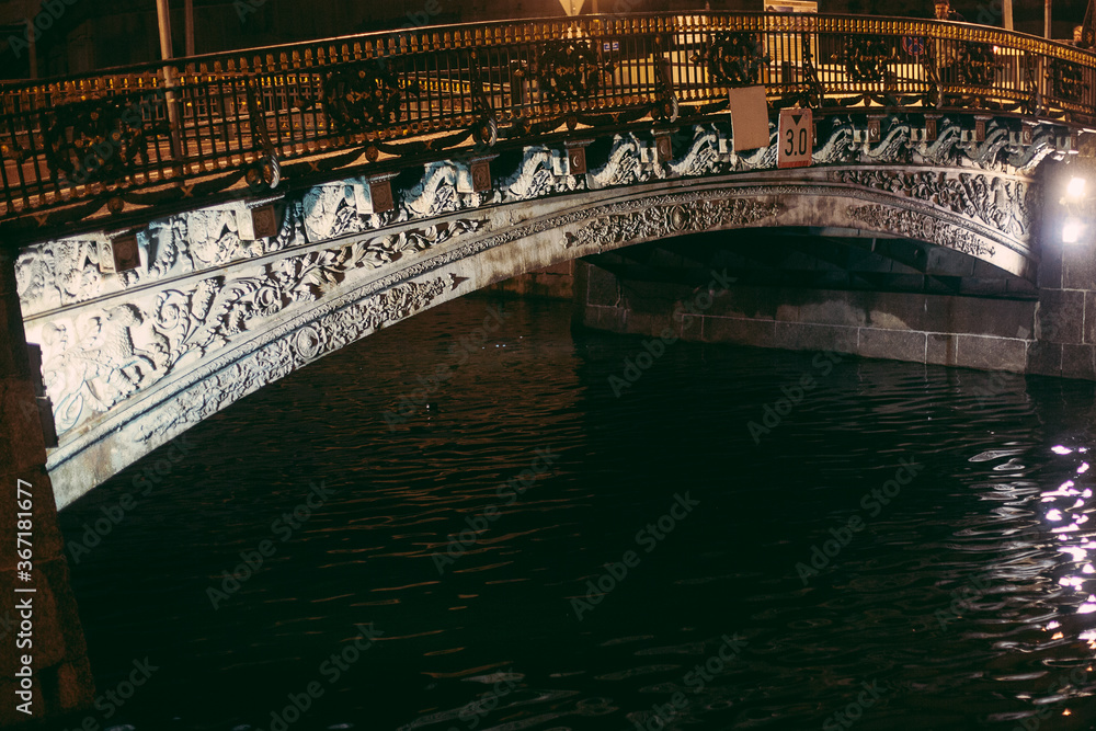 Fototapeta premium Bridge over the river. Night city landscape