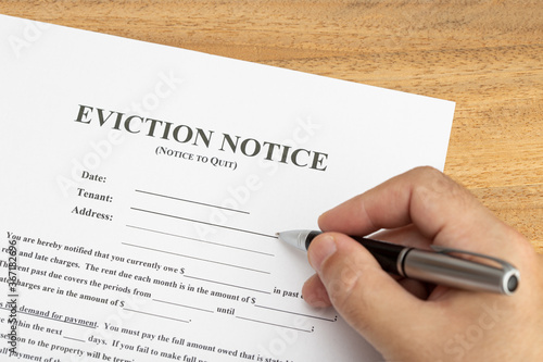 Obraz na płótnie Hand ready to fill a Eviction Notice Document