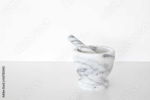 Marble mortar and pestle on a white background.