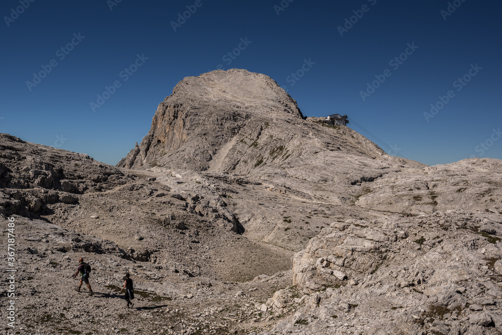 Cima della Rosetta mountain & cable car station from San Martino di Castrozza, as  seen from moonlike terrain of Pale di San Martino high plateau, Pale di San Martino mountain range, Dolomites, Italy