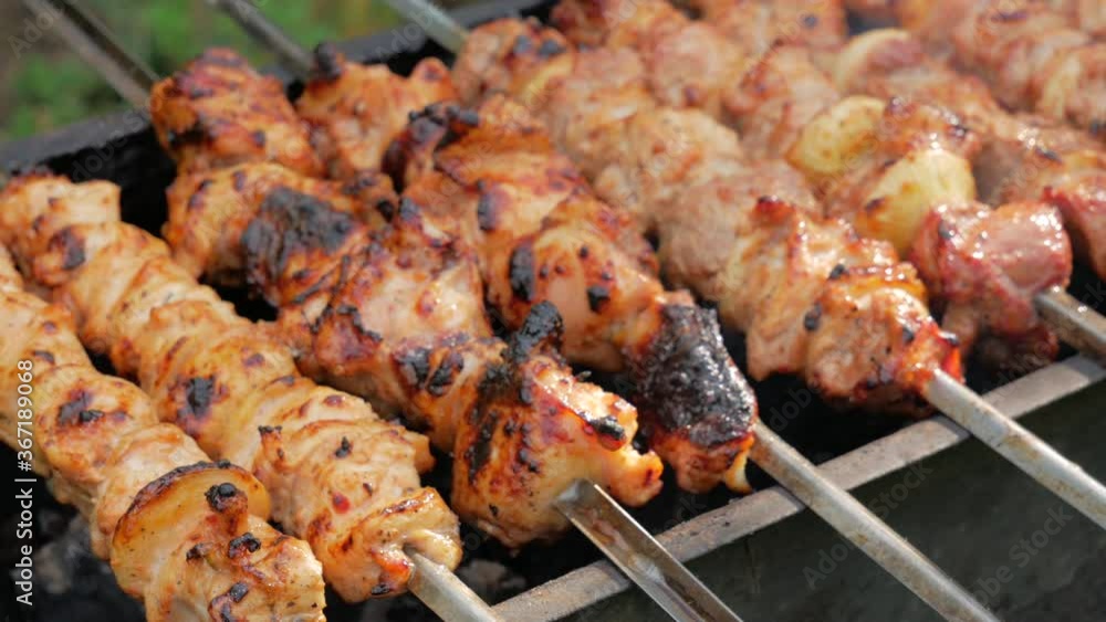 barbecue closeup, meat roasted on the fire, the pork is marinated shish kebab, delicious food barbecue closeup, meat roasted on the fire, the pork is marinated shish kebab, delicious food