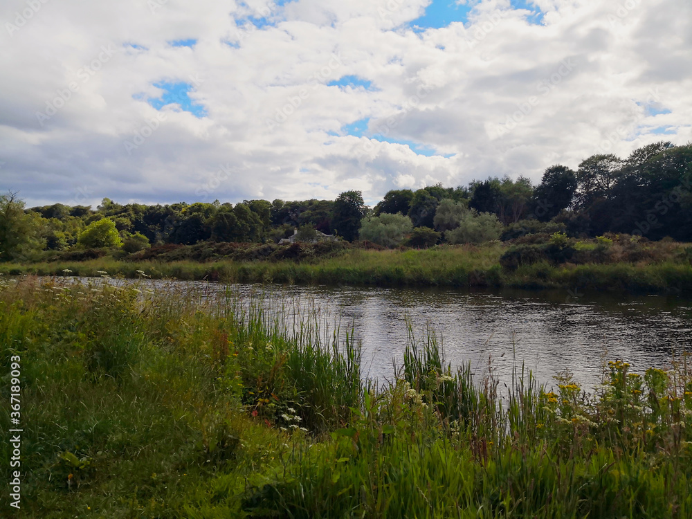 Clouds over the river in Aberdeen, Scotland on a summer day.