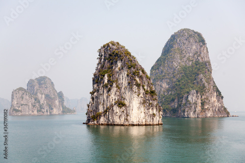 Ha Long Bay, Vietnam, towering limestone islands topped by rainforests, 