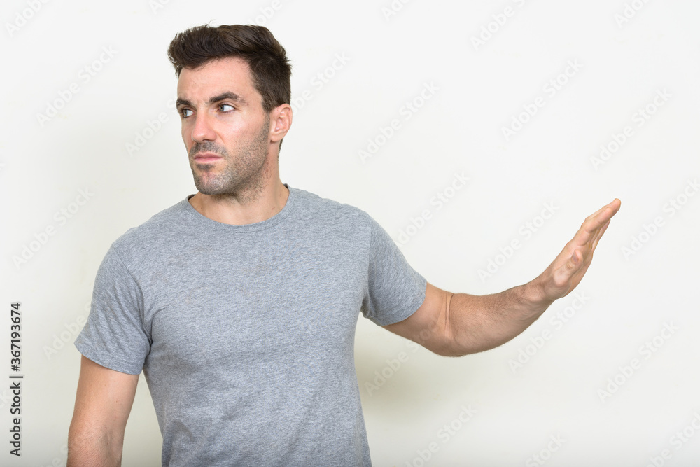 Portrait of handsome Hispanic man with beard stubble Portrait of handsome Hispanic man with beard stubble