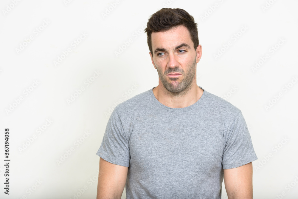 Portrait of handsome Hispanic man with beard stubble Portrait of handsome Hispanic man with beard stubble